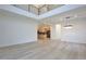 Open-concept living space with a view of kitchen, wood floors, and modern lighting at 2335 Oak Ter, Sarasota, FL 34231