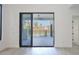View from inside through sliding glass doors to pool and patio area at 2335 Oak Ter, Sarasota, FL 34231