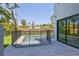 A private swimming pool is surrounded by a paved patio and protected by a safety fence at 2335 Oak Ter, Sarasota, FL 34231