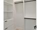 Well-organized walk-in closet with shelving and rods, providing ample storage and a clean, modern look at 2335 Oak Ter, Sarasota, FL 34231