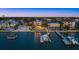 Waterfront living at its finest with a private dock, boat lift, and stunning views of the bay from this coastal retreat at 2438 Baywood W Dr, Dunedin, FL 34698