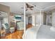 Spacious main bedroom with hardwood floors, fireplace, sitting area, and ample closet space at 2438 Baywood W Dr, Dunedin, FL 34698