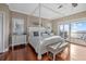 Bedroom featuring hardwood floors, stylish decor, and natural light at 2438 Baywood W Dr, Dunedin, FL 34698