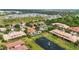 Aerial view of the community, showcasing the pool, lake with fountain, and well-maintained landscaping at 2745 62Nd E Ave, Ellenton, FL 34222
