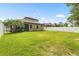 Large backyard with privacy fence, screened patio, and beautiful landscaping, ideal for entertaining at 2745 62Nd E Ave, Ellenton, FL 34222
