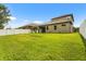 This home has a serene backyard with a well-kept lawn, privacy fence, and beautiful landscaping at 2745 62Nd E Ave, Ellenton, FL 34222