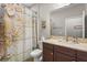 Bathroom featuring a vanity with a granite countertop, decorative seashell shower curtain and matching décor at 2745 62Nd E Ave, Ellenton, FL 34222