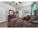 Comfortable bedroom with a ceiling fan, and large furniture at 2745 62Nd E Ave, Ellenton, FL 34222