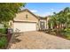 Attractive single-Gathering home with a two-car garage, tile roof, and manicured landscaping at 2745 62Nd E Ave, Ellenton, FL 34222