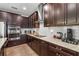 Well-equipped kitchen with dark cabinets, stainless steel appliances, and sleek countertops at 2745 62Nd E Ave, Ellenton, FL 34222