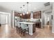 Stylish kitchen featuring stainless appliances, center island with seating, and tile flooring at 2745 62Nd E Ave, Ellenton, FL 34222