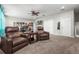 Spacious living area with plush recliners, ceiling fan, and ample lighting at 2745 62Nd E Ave, Ellenton, FL 34222
