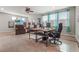 Open-concept living area featuring recliners and a workspace with a large monitor at 2745 62Nd E Ave, Ellenton, FL 34222