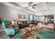 Spacious living room open to kitchen boasts a ceiling fan, and comfortable furniture at 2745 62Nd E Ave, Ellenton, FL 34222