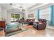 Comfortable living room with large windows, sliding glass doors, and modern decor at 2745 62Nd E Ave, Ellenton, FL 34222