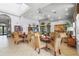 Inviting lounge space featuring tile floors, comfortable seating arrangements, and large arched windows at 2745 62Nd E Ave, Ellenton, FL 34222