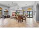 Spacious lounge area with comfortable seating, tile floors, and large arched windows offering natural light at 2745 62Nd E Ave, Ellenton, FL 34222