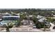 Unfinished modern house surrounded by lush landscaping and luxurious community amenities at 2944 Gulf Of Mexico Dr, Longboat Key, FL 34228