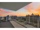 A spacious balcony offers stunning views of the cityscape during a colorful sunset at 301 Quay Commons Dr # 1711, Sarasota, FL 34236