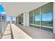 Expansive covered balcony featuring floor-to-ceiling windows and picturesque waterfront views at 301 Quay Commons Dr # 1711, Sarasota, FL 34236