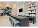 Modern bar area with sleek countertops, stylish seating, and contemporary lighting fixtures at 301 Quay Commons Dr # 1711, Sarasota, FL 34236