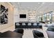 Modern bar area with sleek countertops, stylish seating, and contemporary lighting fixtures at 301 Quay Commons Dr # 1711, Sarasota, FL 34236
