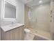 Bathroom featuring a modern vanity with sleek lighted mirror and a luxurious glass-enclosed shower at 301 Quay Commons Dr # 1711, Sarasota, FL 34236