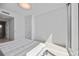 Bright bedroom features a large window with water views and minimal contemporary decor at 301 Quay Commons Dr # 1711, Sarasota, FL 34236