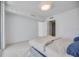 A bright bedroom features a large bed, neutral decor, and access to a closet and en-suite bathroom at 301 Quay Commons Dr # 1711, Sarasota, FL 34236