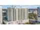 Modern high-rise condo building featuring private balconies, pool, and easy access to city amenities at 301 Quay Commons Dr # 1711, Sarasota, FL 34236