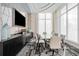 Bright conference room with table, TV, designer carpet and lots of natural light at 301 Quay Commons Dr # 1711, Sarasota, FL 34236