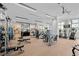 Bright gym with modern equipment including weights, treadmills, and elliptical machines at 301 Quay Commons Dr # 1711, Sarasota, FL 34236
