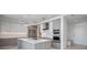 Modern kitchen features sleek cabinetry, stainless steel appliances, and a center island at 301 Quay Commons Dr # 1711, Sarasota, FL 34236