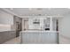 Modern kitchen with sleek cabinetry, stainless steel appliances, and a spacious island, perfect for cooking at 301 Quay Commons Dr # 1711, Sarasota, FL 34236