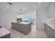Contemporary kitchen featuring an island and an open view to the dining and living areas at 301 Quay Commons Dr # 1711, Sarasota, FL 34236