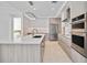 Contemporary kitchen boasting stainless steel appliances, sleek countertops, and custom cabinetry for ample storage at 301 Quay Commons Dr # 1711, Sarasota, FL 34236
