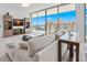 Cozy living room featuring floor-to-ceiling windows with beautiful city views and modern furnishings at 301 Quay Commons Dr # 1711, Sarasota, FL 34236