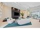 Bright lobby with sleek seating, fireplace, TV, and a view of the building's entrance at 301 Quay Commons Dr # 1711, Sarasota, FL 34236