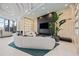 Relaxing lounge area with comfortable seating, a sleek entertainment center, and stylish decor at 301 Quay Commons Dr # 1711, Sarasota, FL 34236