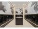Interior view of mailboxes in a secure location with palm tree decoration on the walls at 301 Quay Commons Dr # 1711, Sarasota, FL 34236