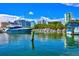 Yacht at a marina with cityscape background on a beautiful day at 301 Quay Commons Dr # 1711, Sarasota, FL 34236