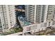 Aerial view of a modern building showcasing a rooftop pool and lounging area at 301 Quay Commons Dr # 1711, Sarasota, FL 34236