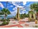 Beautiful waterfront park entrance with ornamental archways and lush tropical landscaping at 301 Quay Commons Dr # 1711, Sarasota, FL 34236