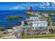 Stunning aerial view of Anna Maria Sound featuring Compass Hotel, marina, waterfront dining, and amazing coastal views at 311 Compass Point Dr # 101, Bradenton, FL 34209