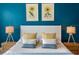 This bedroom offers bright sunflower wall art and stylish decor at 311 Compass Point Dr # 101, Bradenton, FL 34209