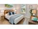 Bedroom featuring modern decor, comfortable bed and light-filled interiors at 311 Compass Point Dr # 101, Bradenton, FL 34209