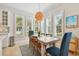 Dining area with plenty of natural light and modern light fixture at 311 Compass Point Dr # 101, Bradenton, FL 34209