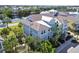 Beautiful two-story home with tropical landscaping and a view of the lake at 311 Compass Point Dr # 101, Bradenton, FL 34209