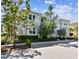 Charming exterior view of a two-story home with manicured landscaping and a welcoming front entrance at 311 Compass Point Dr # 101, Bradenton, FL 34209