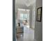 Bright foyer with tile flooring and a view into the living room at 311 Compass Point Dr # 101, Bradenton, FL 34209